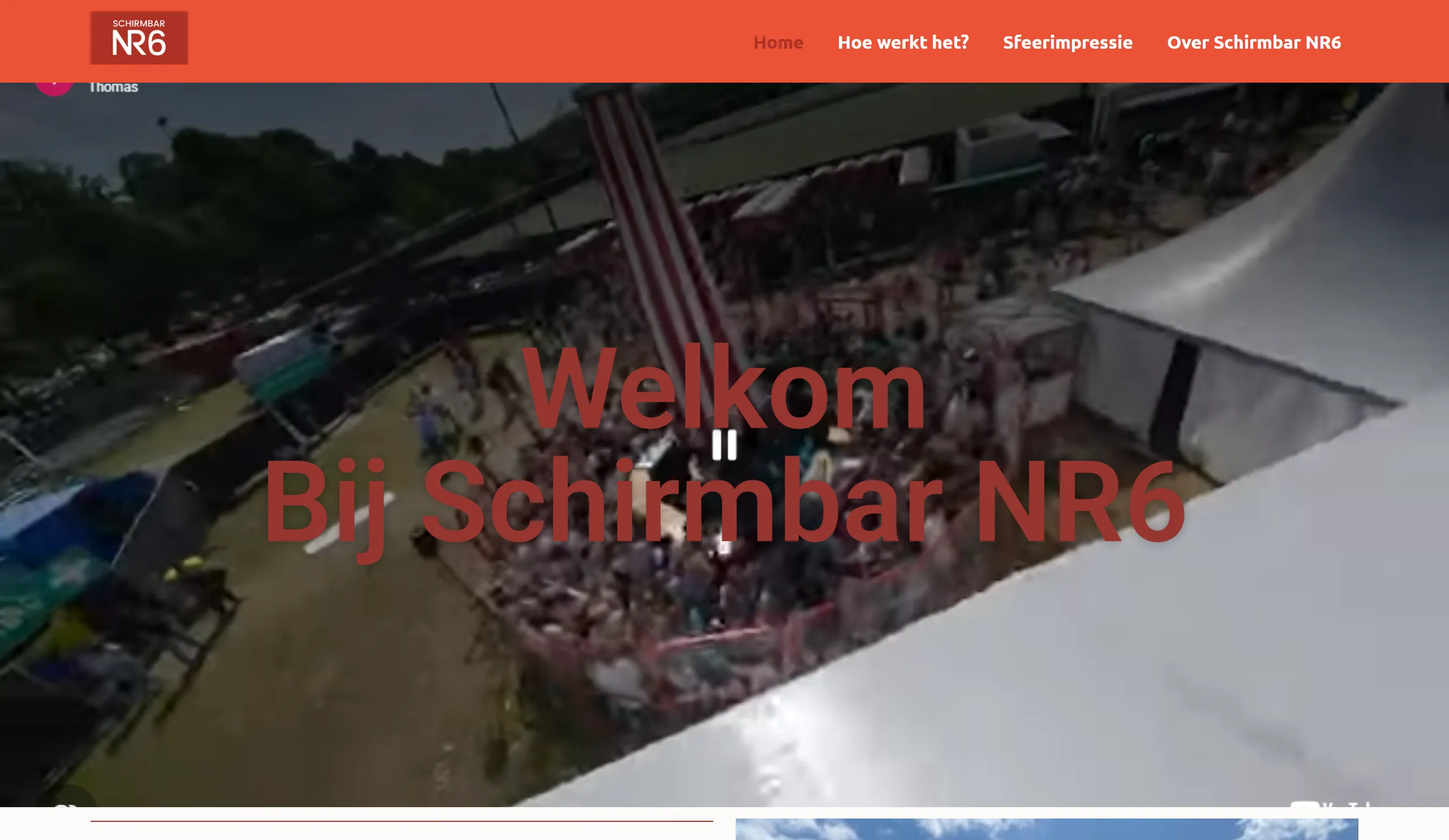 De oude website van Schirmbar NR6: een YouTube-video op de achtergrond met de tekst Welkom bij Schirmbar NR6 er in donkerrood overheen.
